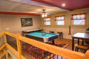 a living room with a pool table in it at Serene Oasis chalet in Gatlinburg