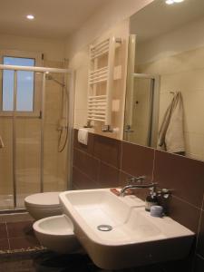 a bathroom with a sink and a toilet and a shower at Your apartment in the Heart of Florence in Florence
