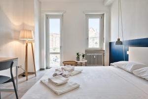 Posteľ alebo postele v izbe v ubytovaní Urban House Carducci - Apartments