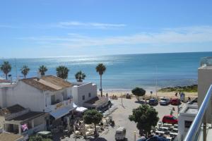 a view of the beach from a building at Duplex - Varandas Do Mar Patricia in Albufeira