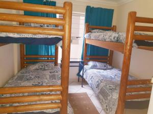 a room with three bunk beds in a house at Chesapeake Bay No.6 in Margate