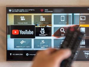 TV a/nebo společenská místnost v ubytování Super Hotel Premier Saitama Higashiguchi
