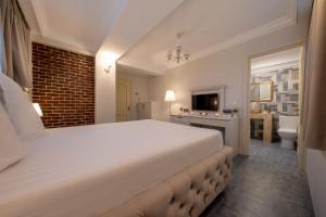 Postel nebo postele na pokoji v ubytování Hotel Casa Fiori
