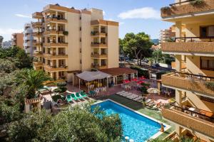 an aerial view of a hotel with a swimming pool and buildings at Apartamentos Arlanza - Only Adults in Playa d'en Bossa