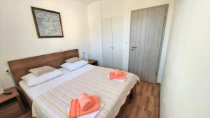 Posteľ alebo postele v izbe v ubytovaní Apartment Ribnjak 10
