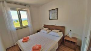 Postel nebo postele na pokoji v ubytování Apartment Ribnjak 10