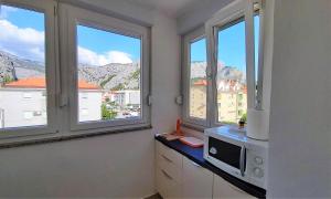 Kuchyňa alebo kuchynka v ubytovaní Apartment Ribnjak 10