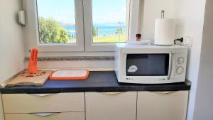 Kuchyňa alebo kuchynka v ubytovaní Apartment Ribnjak 10