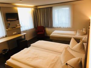 Postel nebo postele na pokoji v ubytování Landhotel Traube