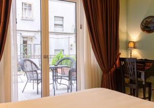 Postel nebo postele na pokoji v ubytování Hotel Patavium