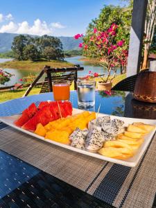 a tray of different types of fruit on a table at Green View Resort in Vang Vieng
