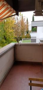 an empty balcony with a bench and a window at Civico 22 Pisa in Pisa