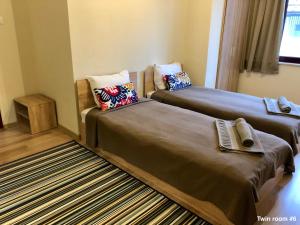 Postel nebo postele na pokoji v ubytování SKYLER GUEST HOUSE