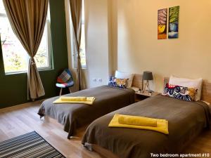 Postel nebo postele na pokoji v ubytování SKYLER GUEST HOUSE