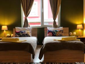 Postel nebo postele na pokoji v ubytování SKYLER GUEST HOUSE