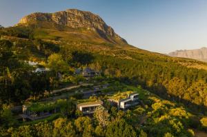 an aerial view of a house in a mountain at Spanish Farm Guest Lodge by Raw Africa Collection in Somerset West