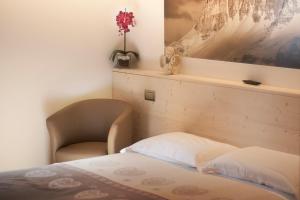Postel nebo postele na pokoji v ubytování Albergo Meublè Victoria