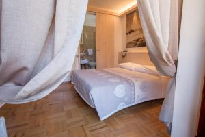 Postel nebo postele na pokoji v ubytování Albergo Meublè Victoria
