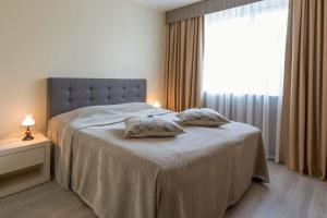 Postel nebo postele na pokoji v ubytování Viiking Spa Hotel