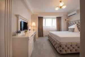 Postel nebo postele na pokoji v ubytování Hotel Casa Fiori
