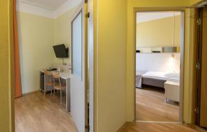 Postel nebo postele na pokoji v ubytování Viiking Spa Hotel