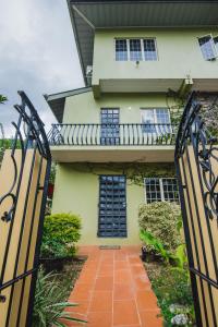 a house with a gate in front of it at The Valley Oasis Inn in Saint Joseph