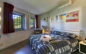 Ένα ή περισσότερα κρεβάτια σε δωμάτιο στο Cottage il Borraccio