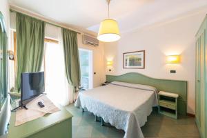 Postel nebo postele na pokoji v ubytování Hotel Kyrton