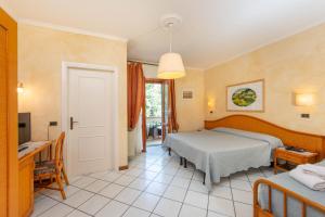 Postel nebo postele na pokoji v ubytování Hotel Kyrton