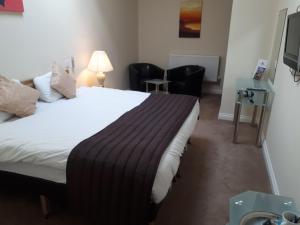 Postel nebo postele na pokoji v ubytování Britannia Hotel Aberdeen