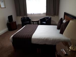 Postel nebo postele na pokoji v ubytování Britannia Hotel Aberdeen