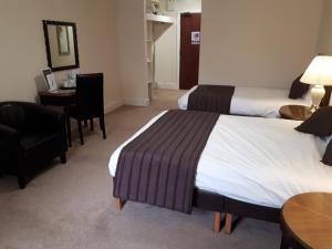 Postel nebo postele na pokoji v ubytování Britannia Hotel Aberdeen