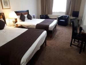 Postel nebo postele na pokoji v ubytování Britannia Hotel Aberdeen