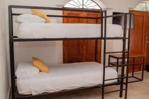 Postel nebo postele na pokoji v ubytování Casa Tulita Valladolid