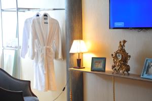 a dressing room with a white robe on a shelf at Brickwall Tbilisi-Tbilisi vibe in Tbilisi City