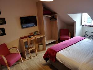 a bedroom with a bed and a television at Dene Guest House, New Town in Edinburgh