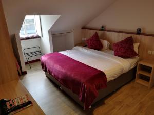 a bedroom with a bed and a dresser at Dene Guest House, New Town in Edinburgh