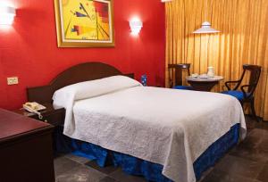 Postel nebo postele na pokoji v ubytování Hotel Tapachula + 21 fotografií