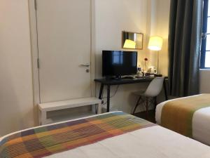 Postel nebo postele na pokoji v ubytování Spices Hotel
