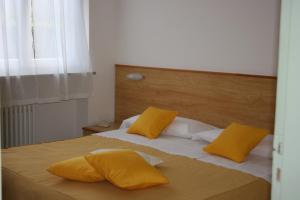 Postel nebo postele na pokoji v ubytování B&B Ortensia