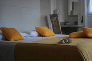 Postel nebo postele na pokoji v ubytování B&B Ortensia