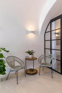 A seating area at 3 Caves by Caldera Houses