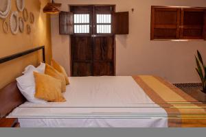 Postel nebo postele na pokoji v ubytování Casa Tulita Valladolid