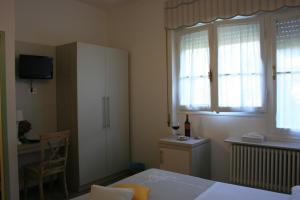 Postel nebo postele na pokoji v ubytování B&B Ortensia