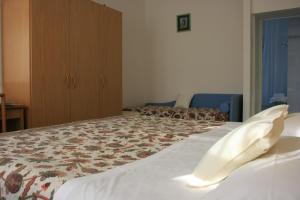 Postel nebo postele na pokoji v ubytování B&B Ortensia
