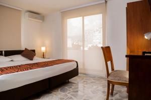 Postel nebo postele na pokoji v ubytování Hotel Flamingo Cali + 37 fotografií