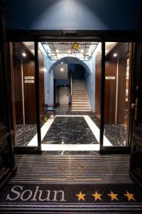a hallway with stars on the floor of a building at Hotel Solun in Trieste