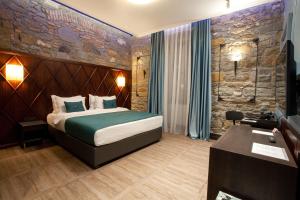 Giường trong phòng chung tại Hotel Solun