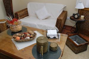a living room with a table and a couch at Casa Monica in Narrillos de San Leonardo