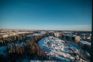 an aerial view of a city in the snow at The Explorer Hotel in Yellowknife